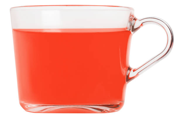 A freshly made cup of fruit tea, studio shot isolated against a white background. Photo contains a clipping path