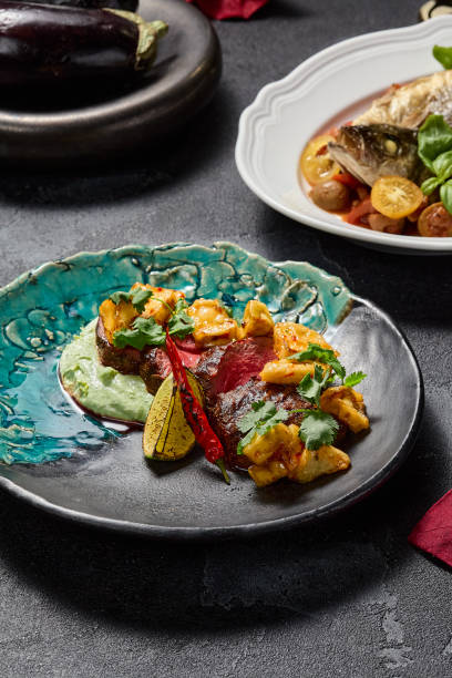 istock Marbled beef steak with crispy eggplants and wasabi puree, aesthetically pleasing and gourmet 1952424948