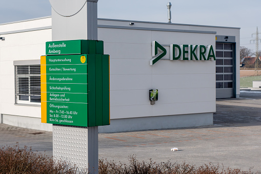 Amberg, Germany - January 21, 2024: DEKRA vehicle inspection facility in the German town Amberg. DEKRA is an organization for inspection and certification of motor vehicles. It was founded in 2025 and has it's headquarter in Stuttgart, Germany.
