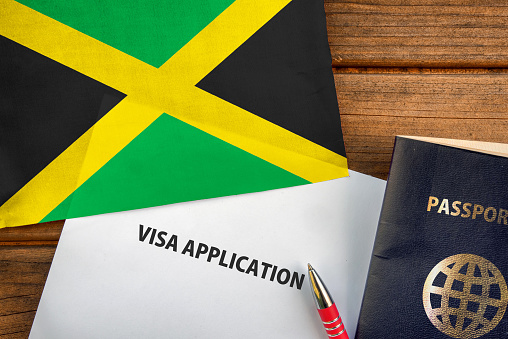 Visa application form, passport and flag of Jamaica