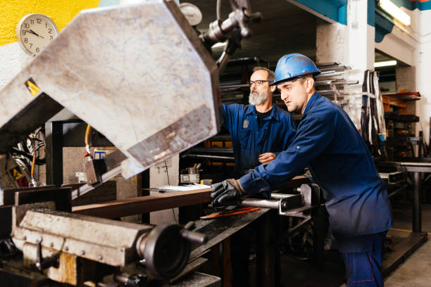 istock Male engineers working in industrial workshop 1952507569