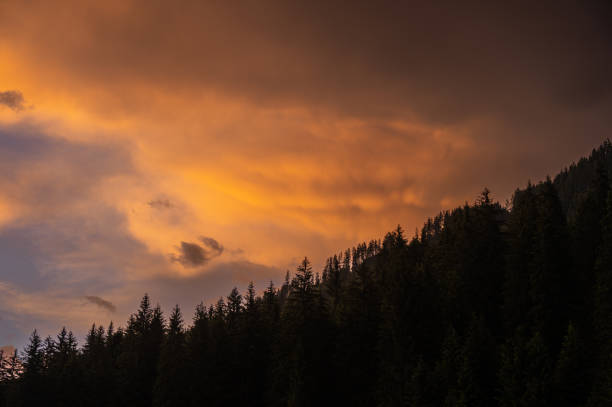 Mount Catinaccio range covered by clouds seen by Pozza di Fassa, Val di Fassa, Dolomites