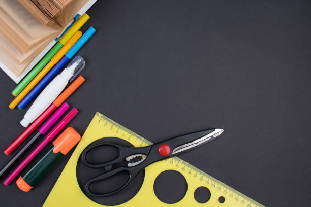 istock Back to school. Stationery on a black table. Office desk with copy space. Flat lay. 1952531208