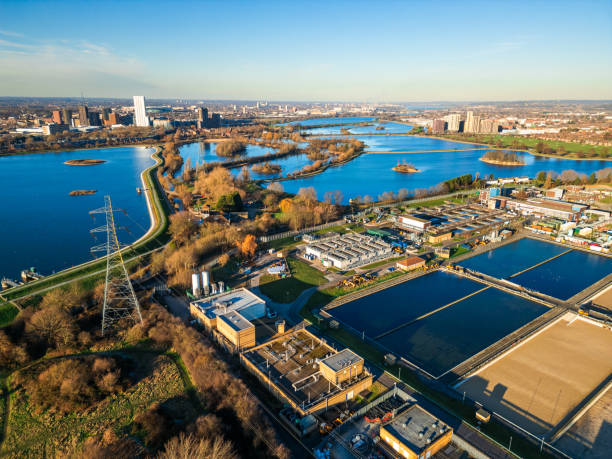 Aerial view of water treatment works in London, UK Aerial view, taken by drone, depicting Coppermills Water Treatment Works in Walthamstow, London, UK. thames valley stock pictures, royalty-free photos & images