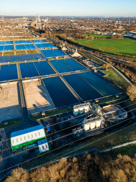 Aerial view of water treatment works in London, UK Aerial view, taken by drone, depicting Coppermills Water Treatment Works in Walthamstow, London, UK. thames valley stock pictures, royalty-free photos & images