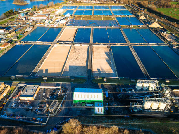 Aerial view of water treatment works in London, UK Aerial view, taken by drone, depicting Coppermills Water Treatment Works in Walthamstow, London, UK. thames valley stock pictures, royalty-free photos & images