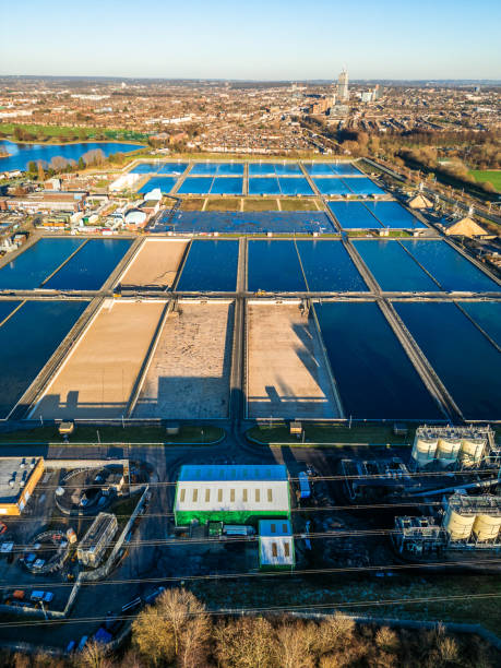 Aerial view of water treatment works in London, UK Aerial view, taken by drone, depicting Coppermills Water Treatment Works in Walthamstow, London, UK. thames valley stock pictures, royalty-free photos & images