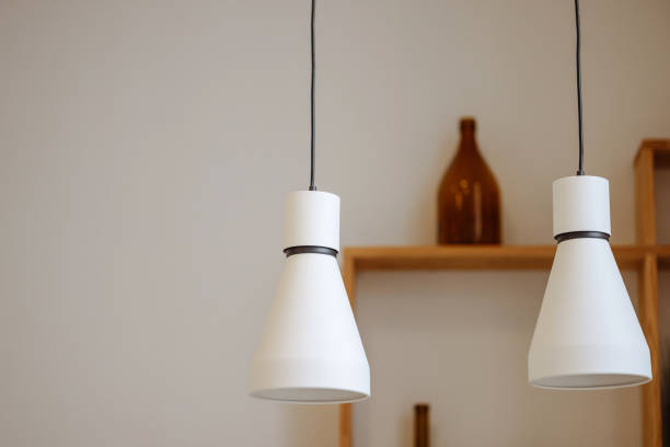 istock Modern white pendant lamps in minimalist interior 1952572956