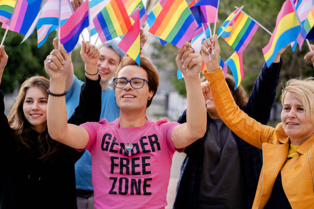 istock People on a pride event holding flags over their heads 1952572970
