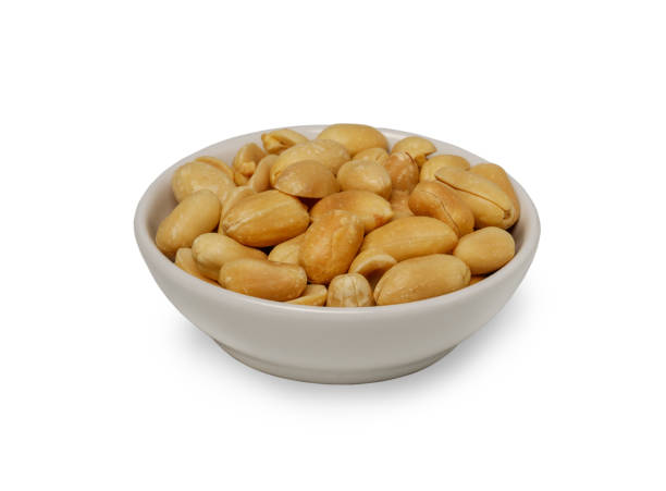 istock Small bowl of roasted salted peanuts isolated on white background. with Clipping path. 1952585722