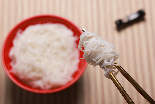 Rice noodles on chopsticks