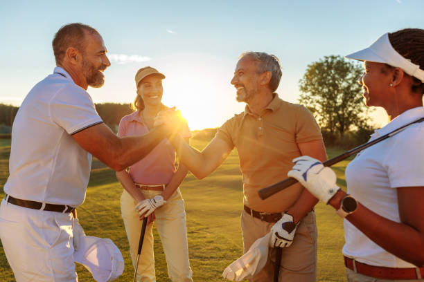 istock Two golfers high fiving on a golf course 1952592537