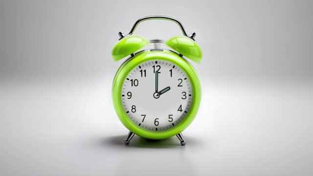 Alarm clock ringing at 2 o'clock. It's ticking quickly  on a white background in the studio lights. The concepts of speed, time, deadline, waking up, stress, bell rings, hour, time lapse, schedule, calendar date, finalize, retro style