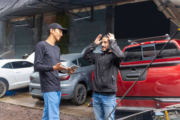 Car owner reacting to how much it will cost to fix his car
