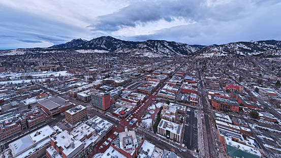 Pearl Street Mall in the winter, Boulder Colorado, with CU Boulder iand the flatirons in the background