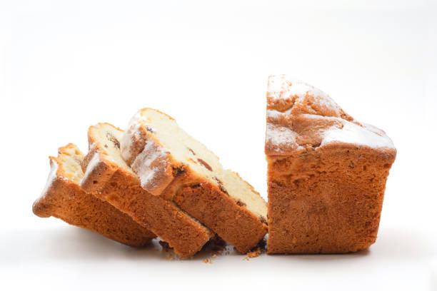Homemade sliced muffin on white background, closeup.