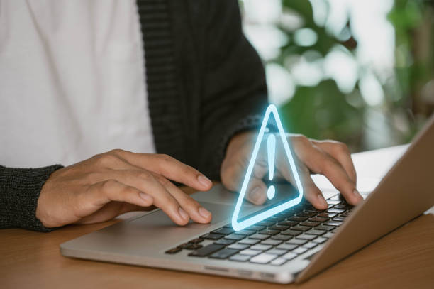 istock notice of a hacked system following a cyberattack on a network. compromised notion of information. online malware, cybercrime, and cybersecurity. Cybercriminals use hackers to steal information 1952673392