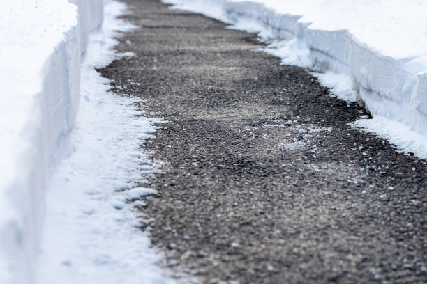 istock Road with salt to melt snow in winter. 1952674979