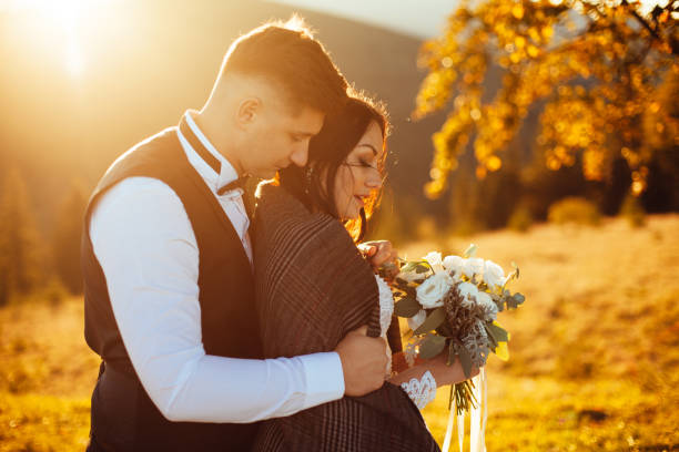 istock wedding couple sunset holding hands 1952676119