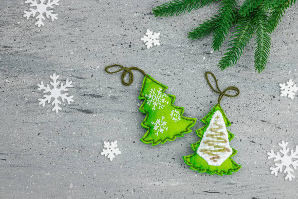 istock Traditional New Year composition.Festive handmade decor, Christmas trees embroidered with a cross 1952676658