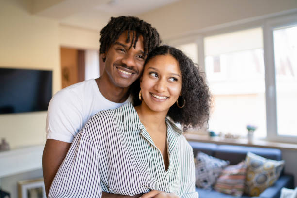 istock Heterosexual couple embracing and smiling 1952683738