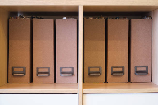 istock Filling the office cabinet with folders with documents, arranging files 1952684871