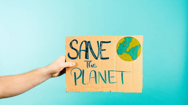 istock Hand Holding Cardboard Sign with Save The Planet Earth Illustration 1952685952