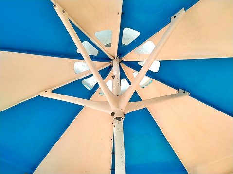 Blue and white pattern on a large umbrella