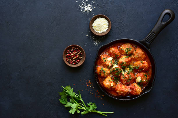 istock Meatballs with rice in tomato sauce. Top view with copy space. 1952707604