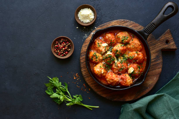 istock Meatballs with rice in tomato sauce. Top view with copy space. 1952714021