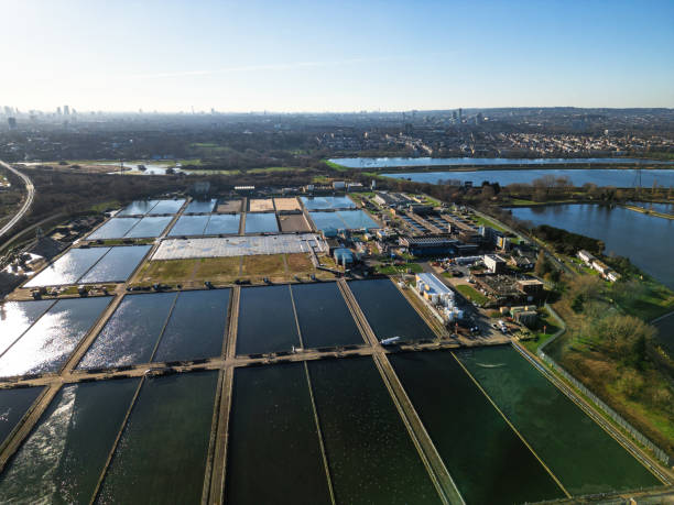 Aerial view of water treatment works in London, UK Aerial view, taken by drone, depicting Coppermills Water Treatment Works in Walthamstow, London, UK. thames valley stock pictures, royalty-free photos & images