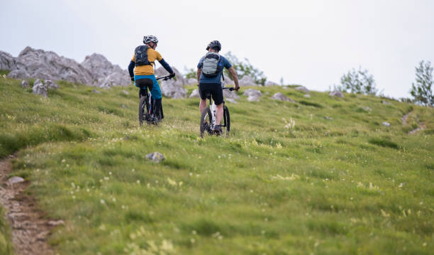 istock Two Men Riding Electric Mountain Bikes 1952726882