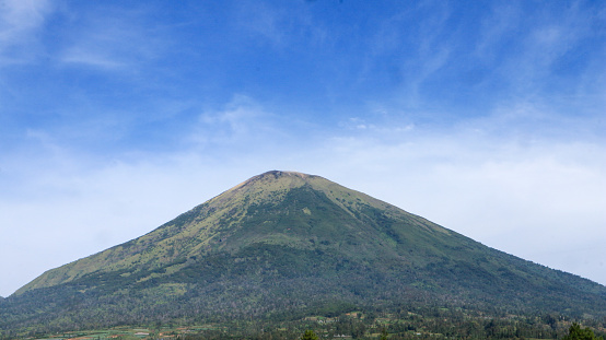 Sindoro Mountain with blue sky, Central Java Indonesia.