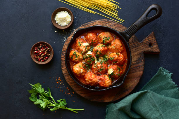 istock Meatballs with rice in tomato sauce. Top view with copy space. 1952741728