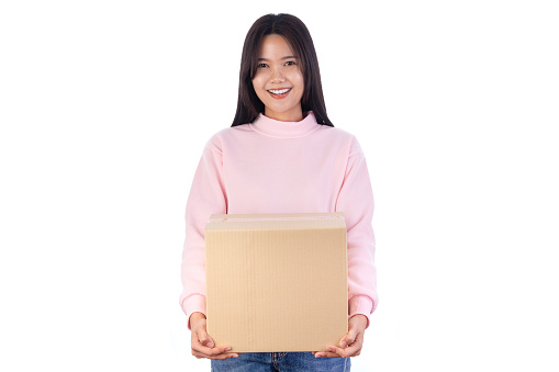 Young woman holding package parcel box isolated on white background