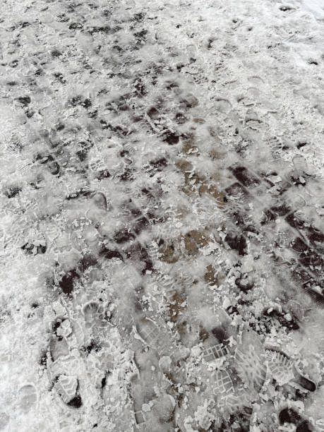 istock Paving slabs covered with snow. Background 1952765813
