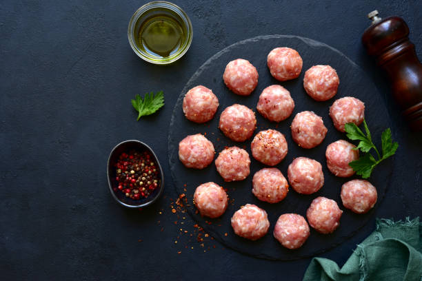 istock Homemade raw meatballs. Top view with copy space. 1952816572