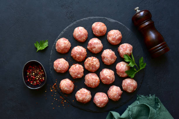 istock Homemade raw meatballs. Top view with copy space. 1952816574