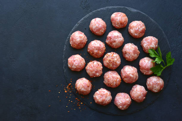 Homemade raw meatballs. Top view with copy space.