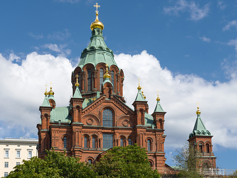 Uspenski Cathedral in the capital city of Helsinki on hill top close to the harbur in summer under blue skyscape. 100 MPixel Hasselblad X2D Architecture Shot of view to the greek orthodox domed landmark cathedral. Situated in Helsinki Finland, it is the largest Greek Orthodox church in Western Europe. Helsinki, Finland, Nordic Countries, Northern Europe