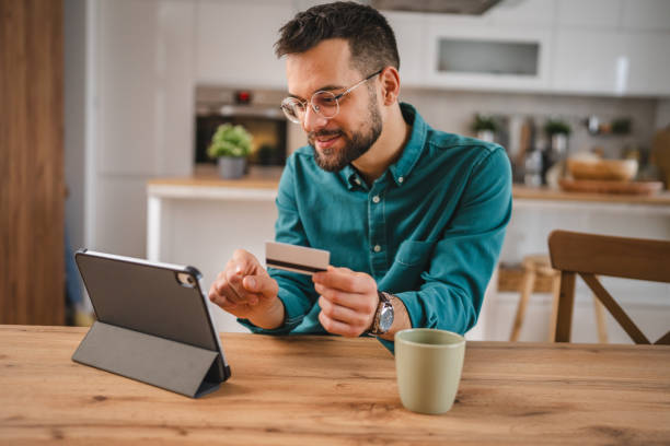 istock online shopping man hold credit or debit card make online purchase 1952828619