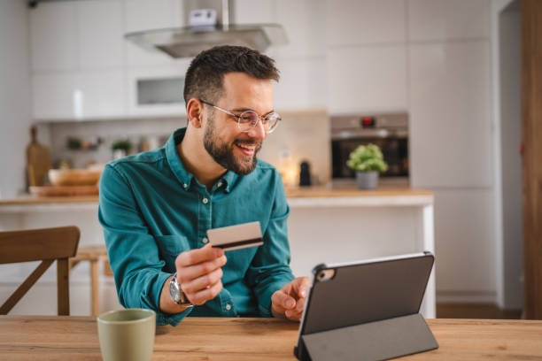 istock online shopping man hold credit or debit card make online purchase 1952830740