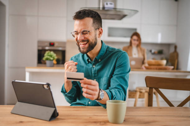 istock online shopping man hold credit or debit card make online purchase 1952830743