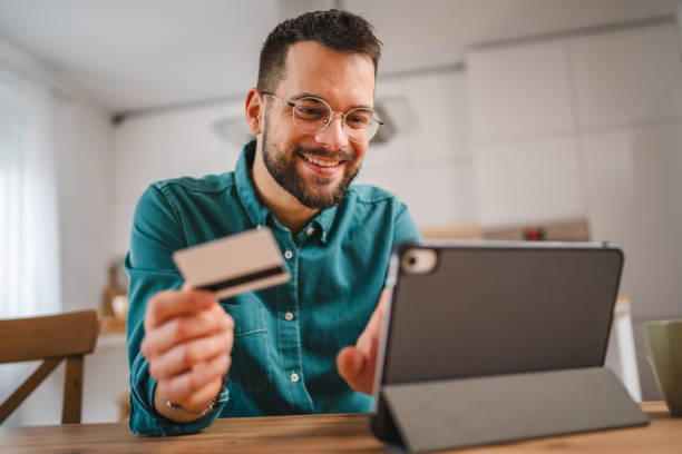 istock online shopping man hold credit or debit card make online purchase 1952837010