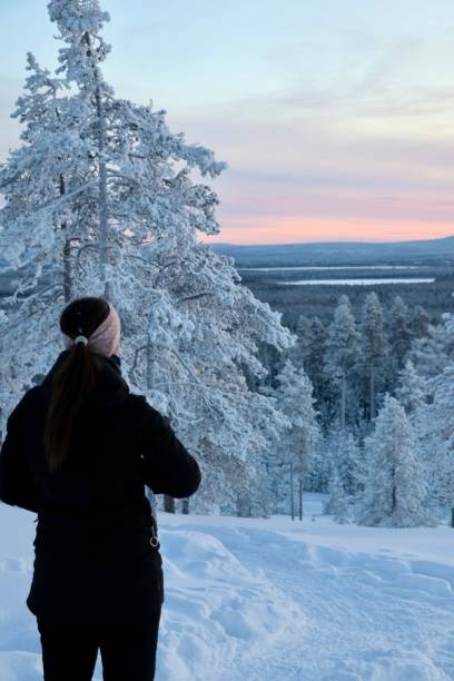 istock Woman in front of snowy landscape - Lapland 1952837050