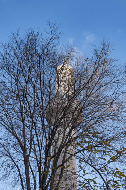 istock huseyin aga camii. Mosque minaret among trees. istanbul, turkey. 1952848346