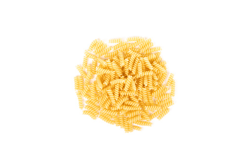 Heap of fusilli isolated on white background