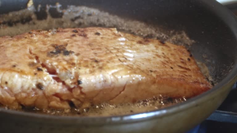 Cooking Salmon in Garlic and Butter in a Cast Iron Pan