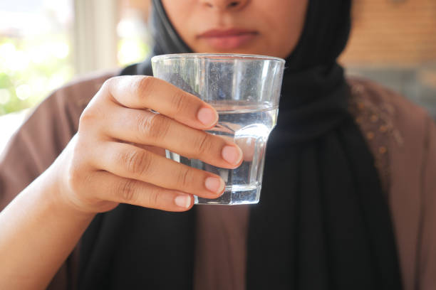 istock young women drinking glass of water 1952867981