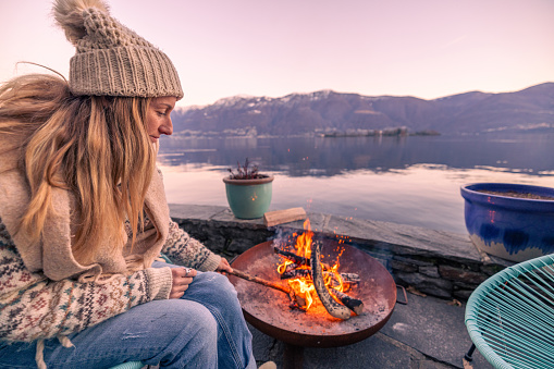 Embracing staycations in Europe, Enjoying an outdoor moment by the fire, vacation rental, staycation concept